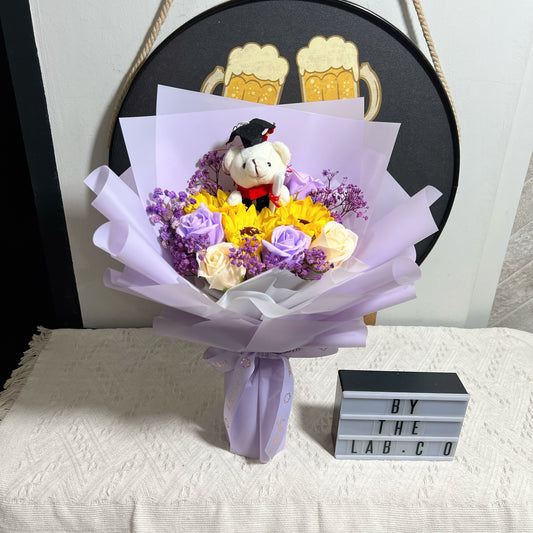 Graduation Bear with Soap Sunflower and Roses Bouquet - Purple